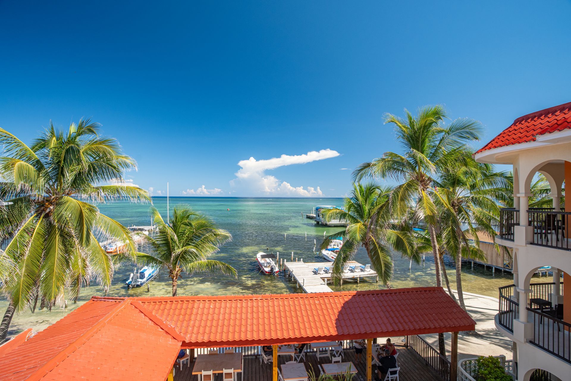 A view of the ocean from the balcony of a hotel.