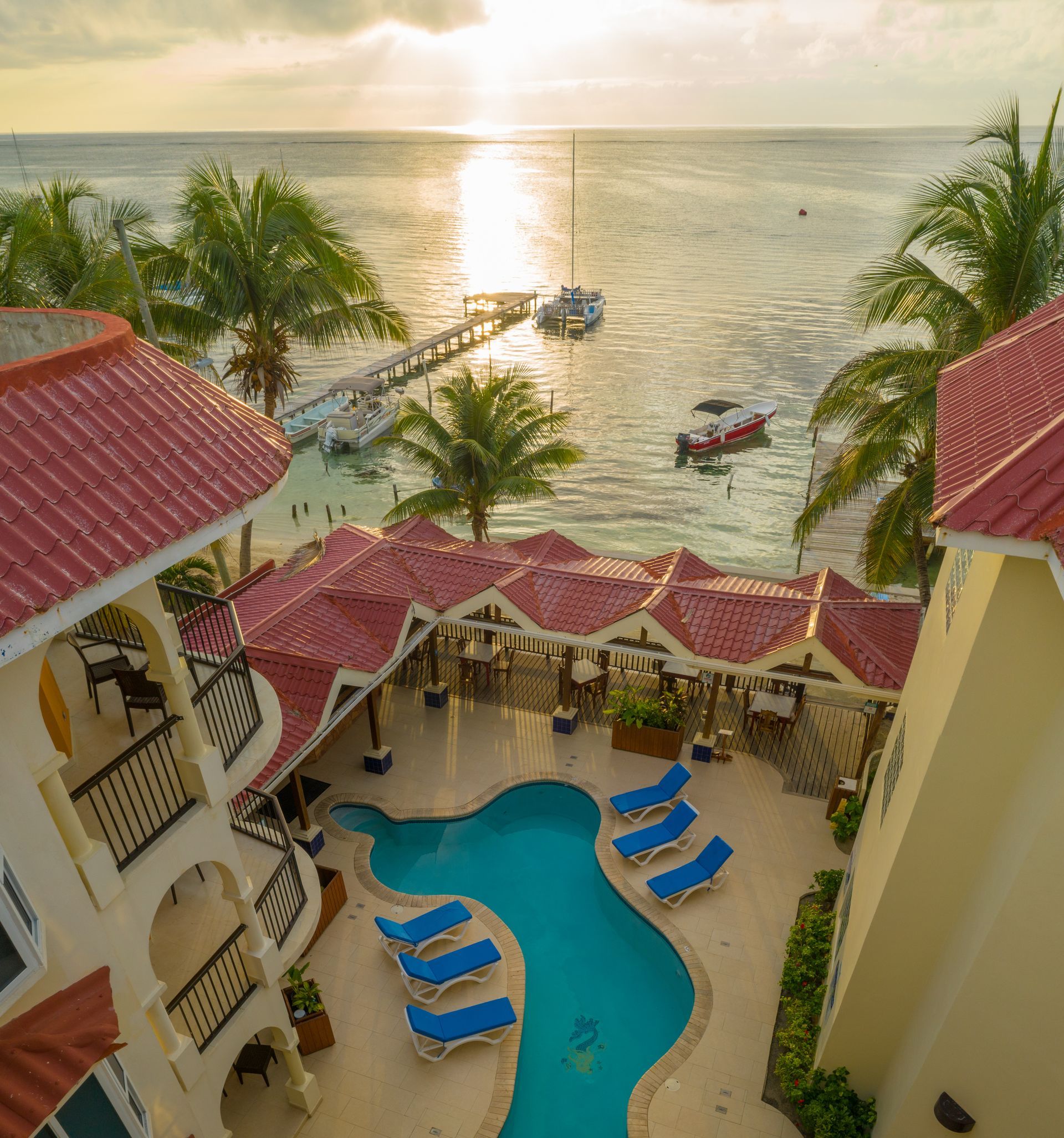 An aerial view of a resort with a swimming pool