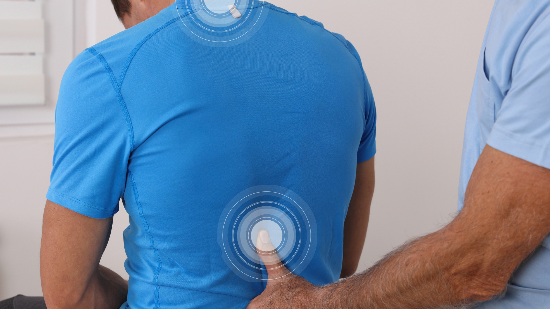 A healthcare professional examines a patient's back, with digital circular overlays highlighting the neck and lower back.