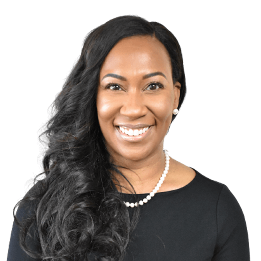 Woman with long dark hair, wearing a black top and pearl necklace, smiling.