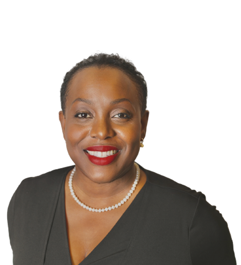 Woman with red lipstick wearing a black top and a pearl necklace, smiling.