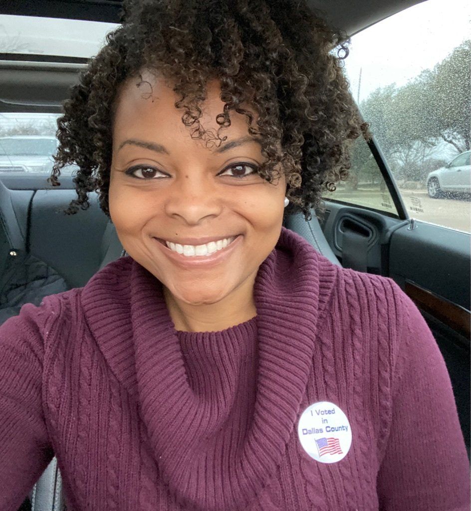 Woman wearing a purple sweater with a 