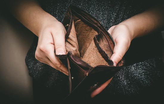 Financial Status — Man Opening His Empty Wallet in Valdosta, GA