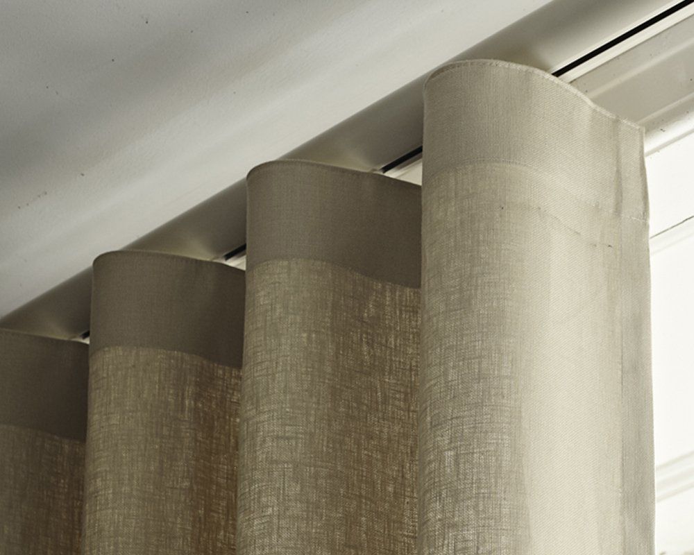 A Close up Of a Pair of Curtains Hanging on A Window — Creative Curtains & Blinds In Tweed Heads South, NSW