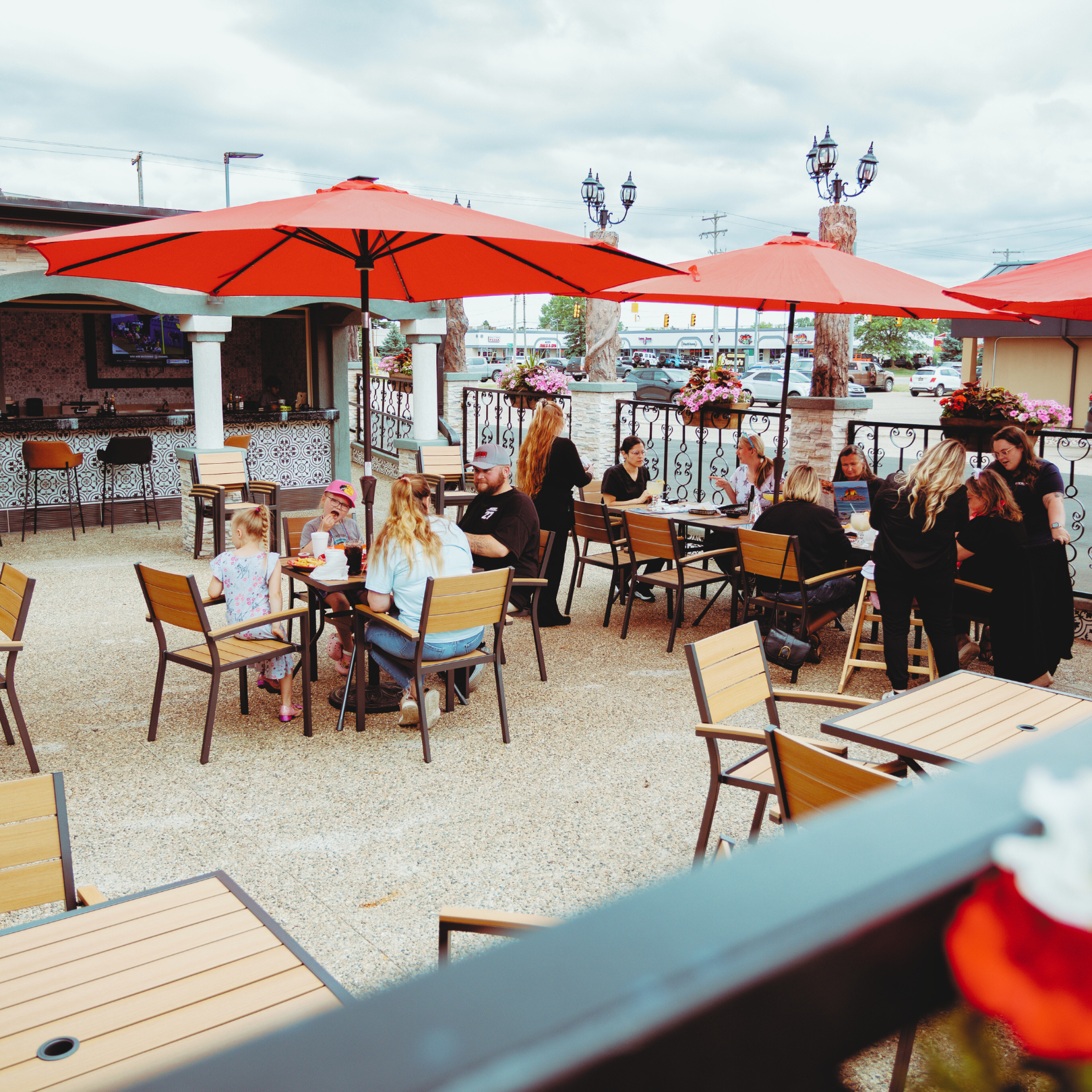 Outdoor patio dining with umbrellas - premium patio restaurant experience Nuevo Vallarta 2 Flint