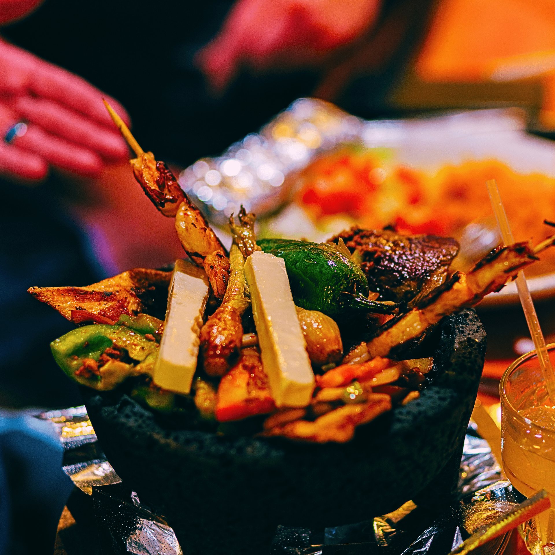 Nuevo Vallarta 2 signature molcajete with grilled steak chicken shrimp in volcanic stone bowl Flint