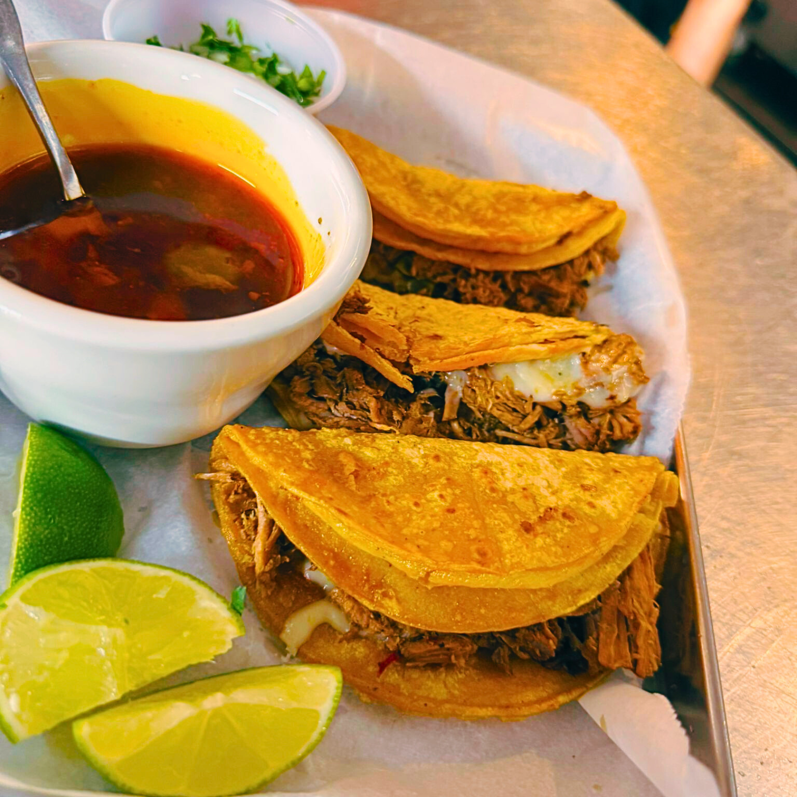 Authentic quesabirrias with consommé dipping sauce - viral Mexican dish at Nuevo Vallarta 2 Flint