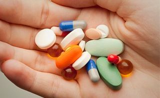 Pills on person's palm —  Prescription Drugs in Oxnard, CA