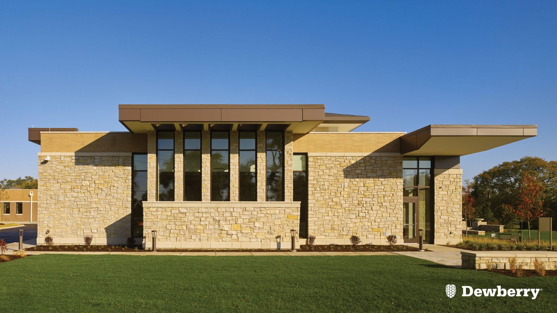 A large stone building with a blue sky in the background