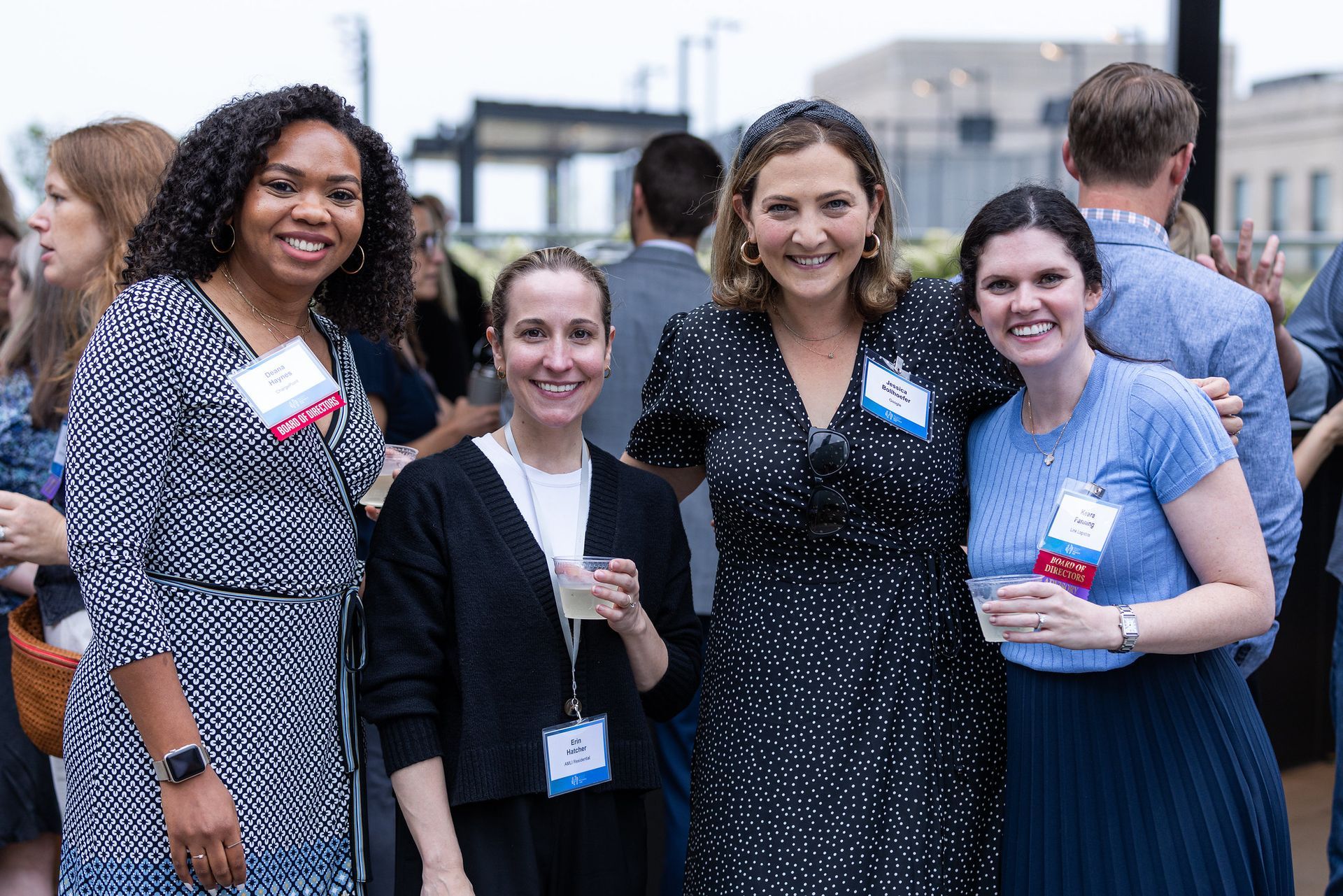 A group of women are posing for a picture together at a party.