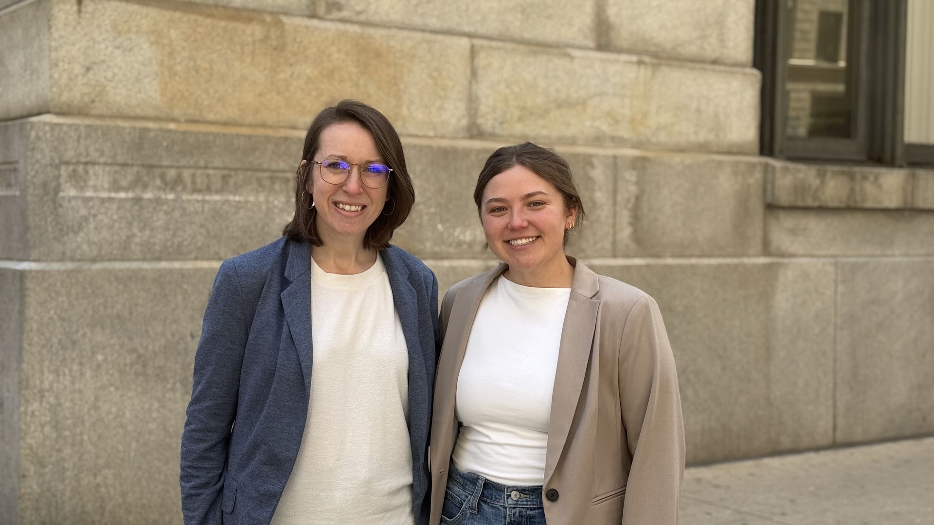 Two women smiling.