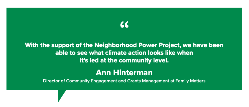 A green sign with a quote from ann hinterman