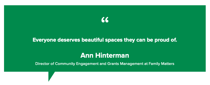 A green speech bubble with a quote from ann hinterman