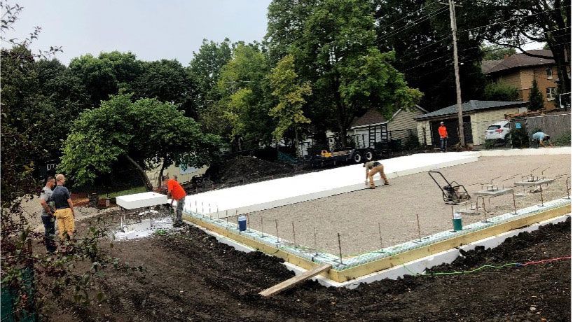 A group of people are working on a construction site.