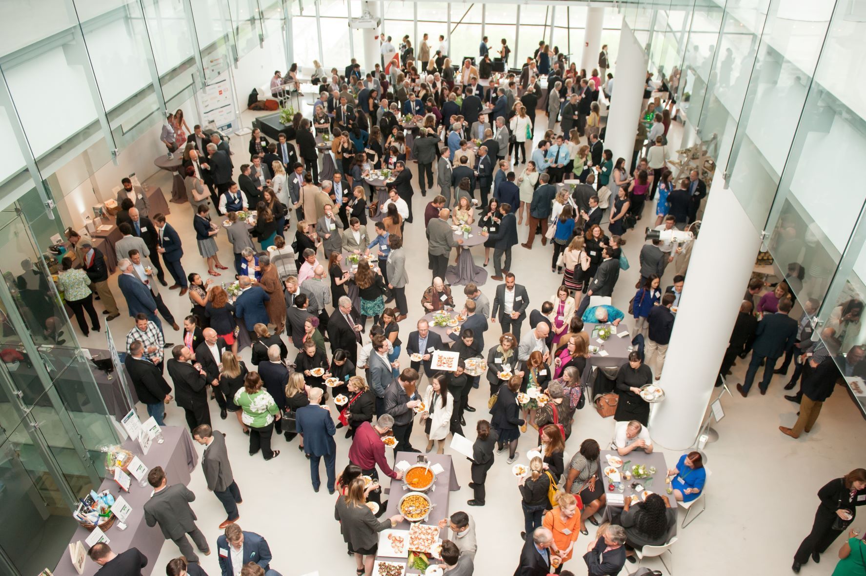 A large group of people are gathered in a large room.