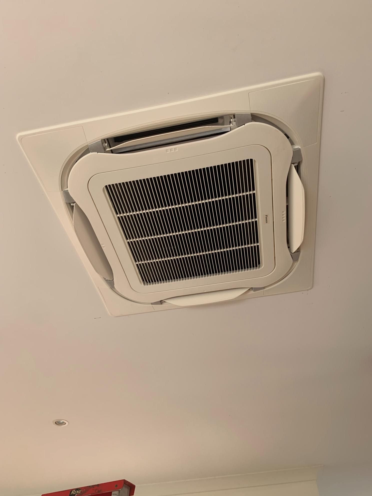 A Square Air Conditioner is Hanging From the Ceiling in a Room — Condie Refrigeration & Air Conditioning In Murwillumbah, NSW