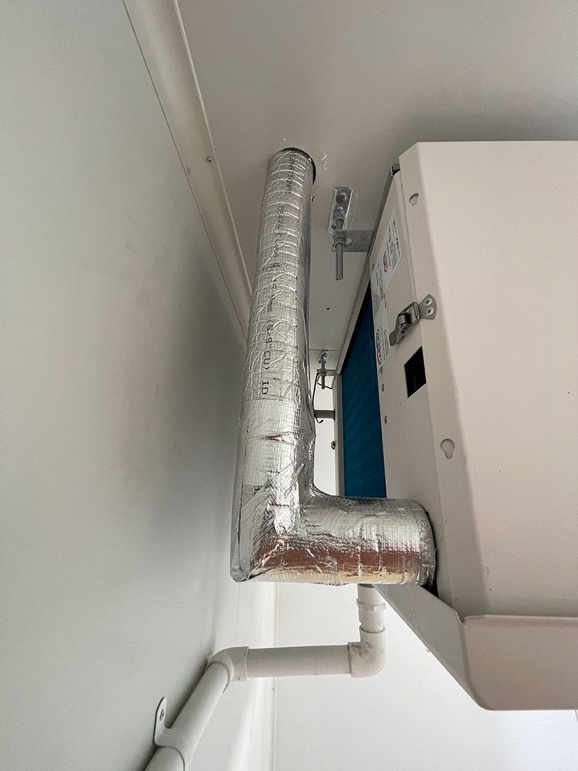 A Close Up of a Pipe Hanging From the Ceiling Next to a Wall — Condie Refrigeration & Airconditioning in Ocean Shores, NSW
