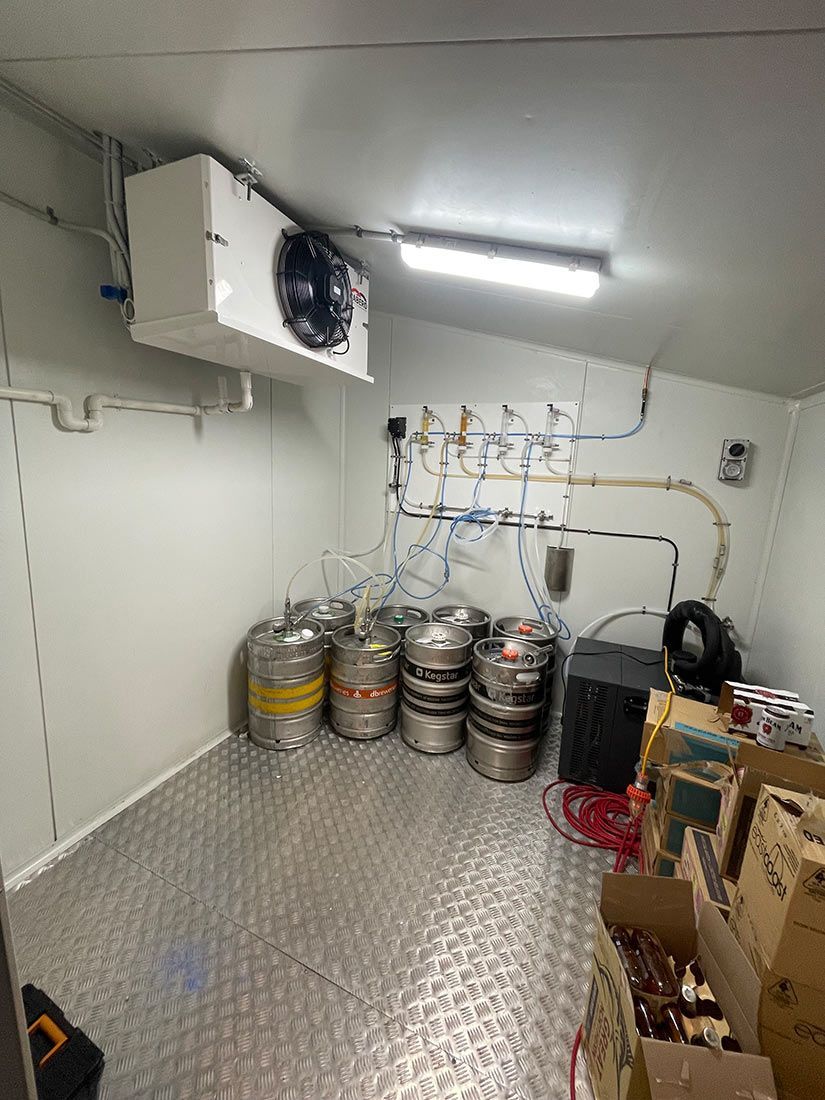 A Room Filled With Lots of Kegs and Boxes — Condie Refrigeration & Airconditioning in Ocean Shores, NSW