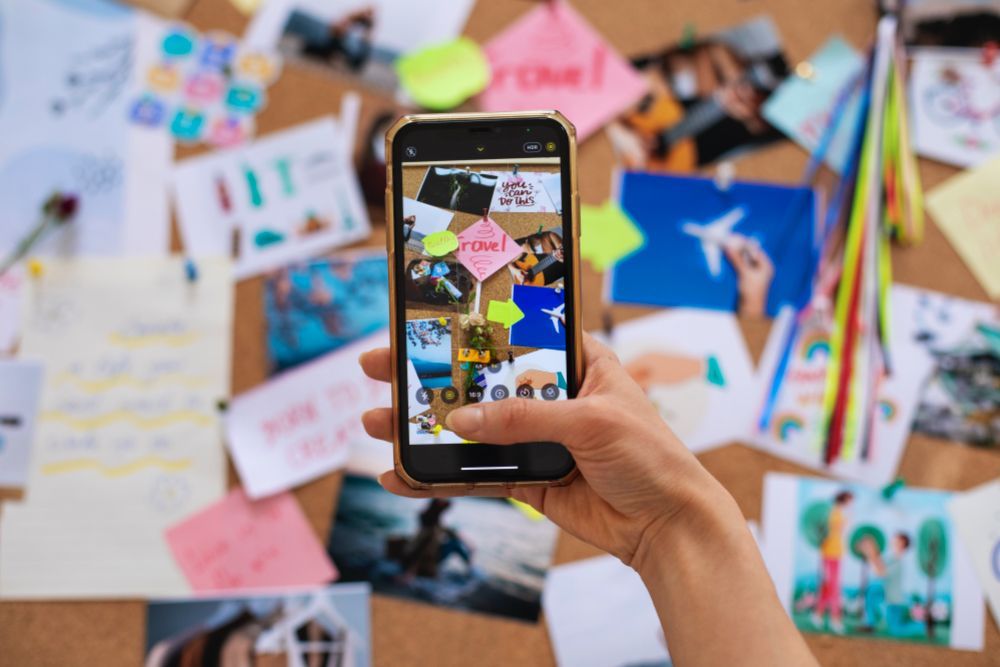 Woman holding the phone to photograph social media content