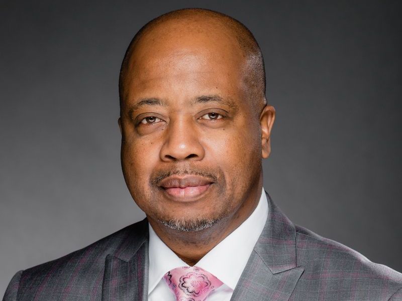 Business headshot of an African-American business executive, created by The D5 Group. 