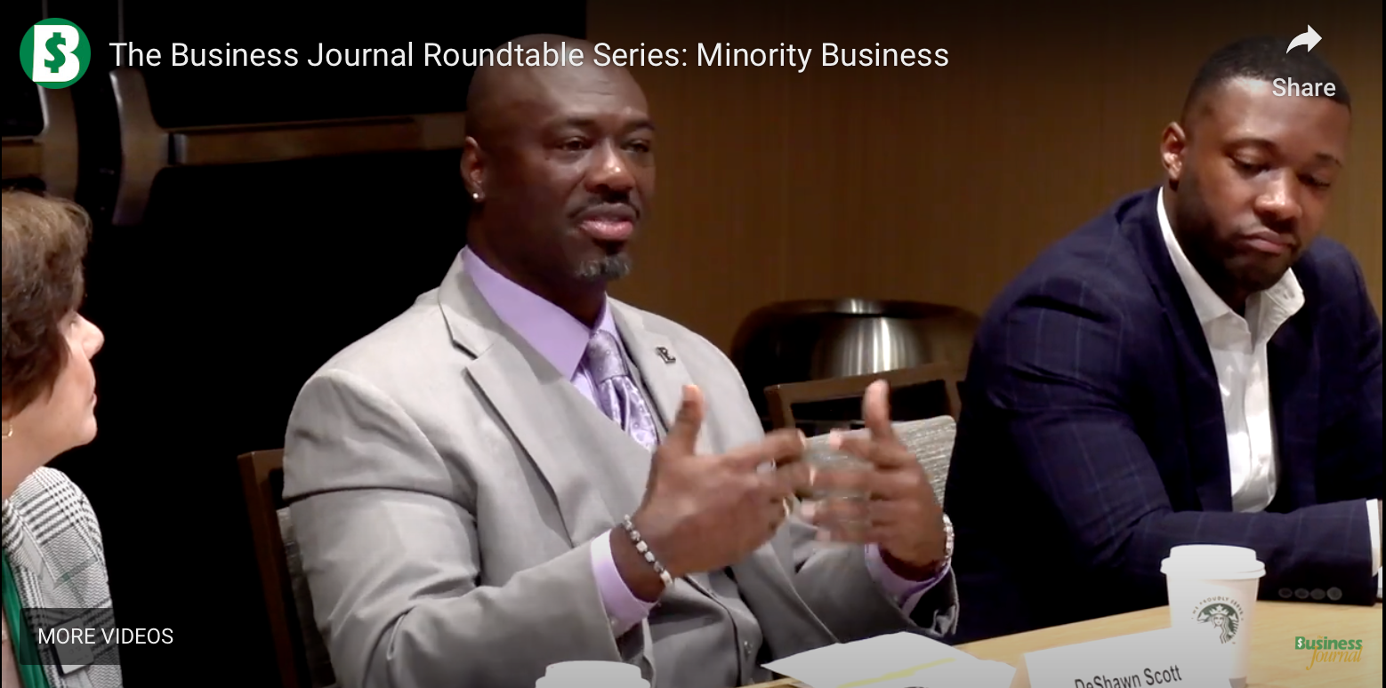 The D5 Group CEO, DeShawn Scott, speaks at a minority business roundtable. 