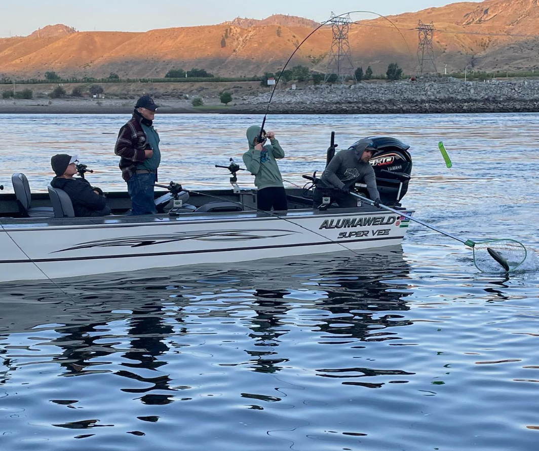 Young angler with Washington fishing license, fishing.