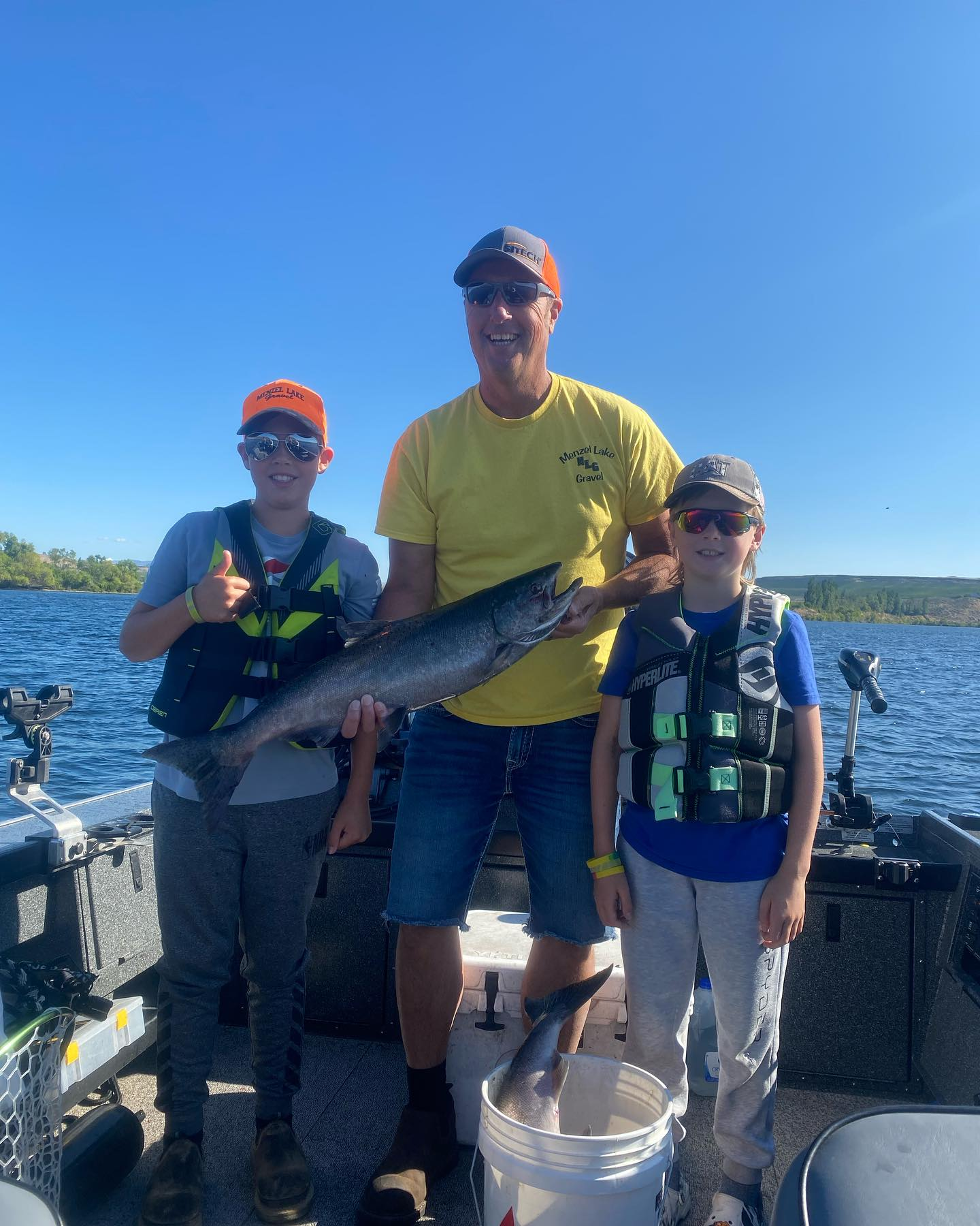 Anglers holding trophy summer chinook salmon on Upper Columbia River near Brewster Washington