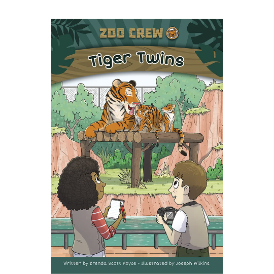 Girl with a notebook and a boy with a camera are looking at a zoo enclosure with a tiger and two cubs. Text: Zoo Crew. Tiger Twins.