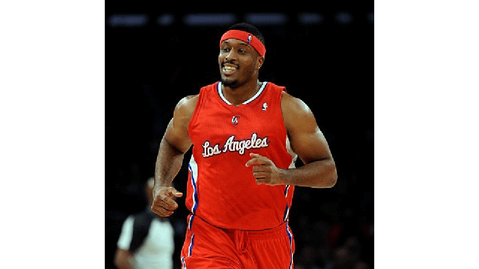 Craig Smith smiling in his Los Angeles Clippers basketball uniform.