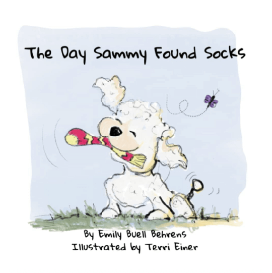 Happy dog outside with a sock in its mouth. Text: The Day Sammy Found Socks.