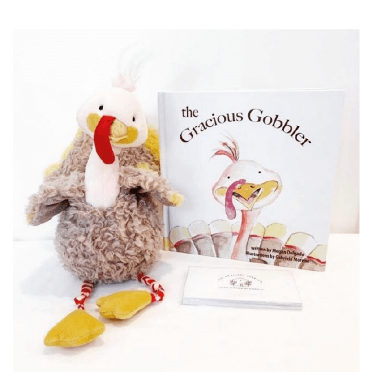 Stuffed animal turkey sitting next to book with turkey on the cover. Text: The Gracious Gobbler.