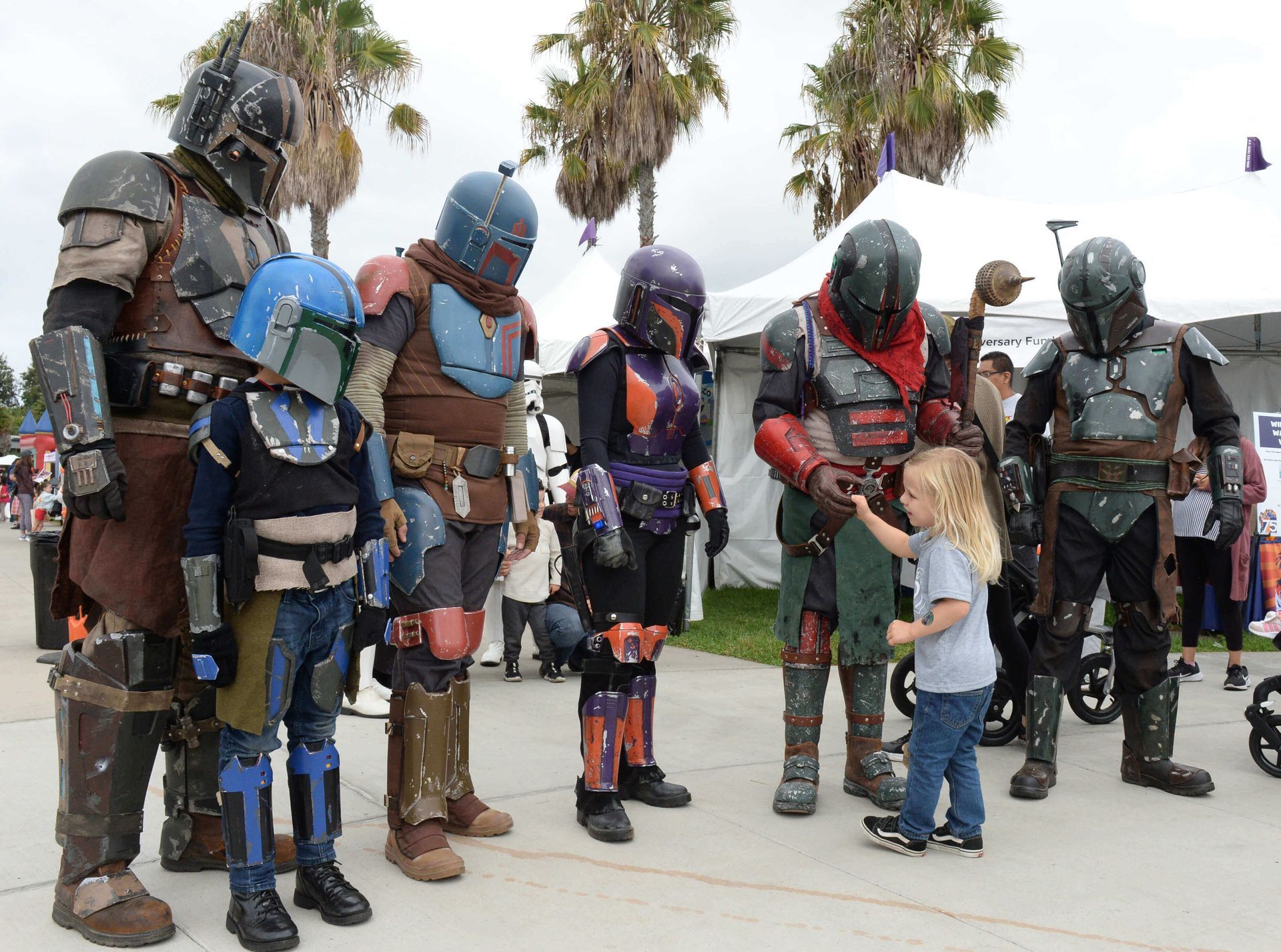Exhibitors from Maliks Books stand at their booth.