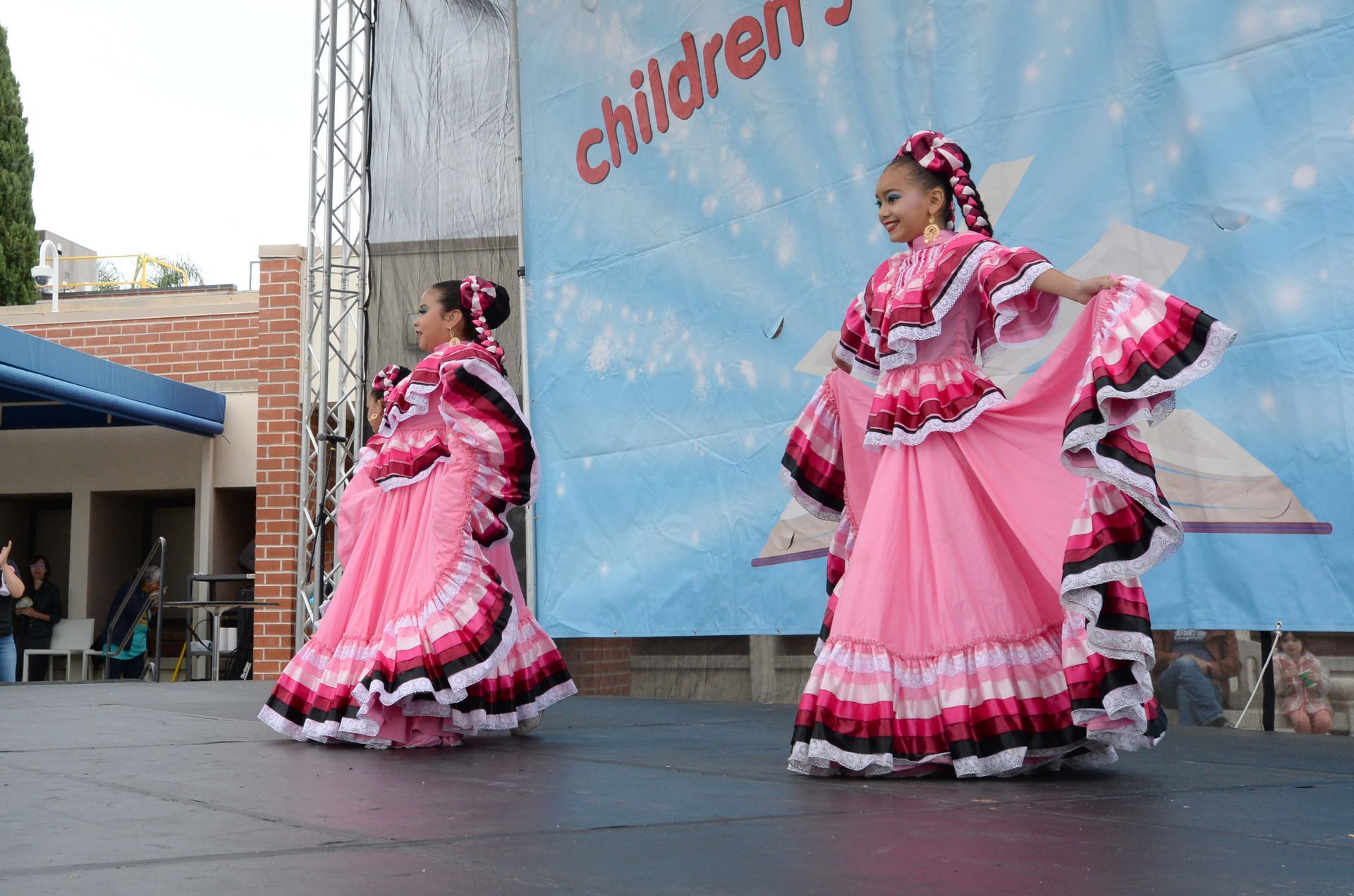 Dance group performs on stage.