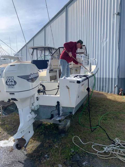 Man Cleaning the Boat — Cedar Point, NC — Dudley's Marina