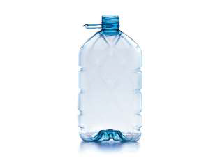 Empty, clear 3lt plastic water bottle with a blue handle and cap, standing upright.