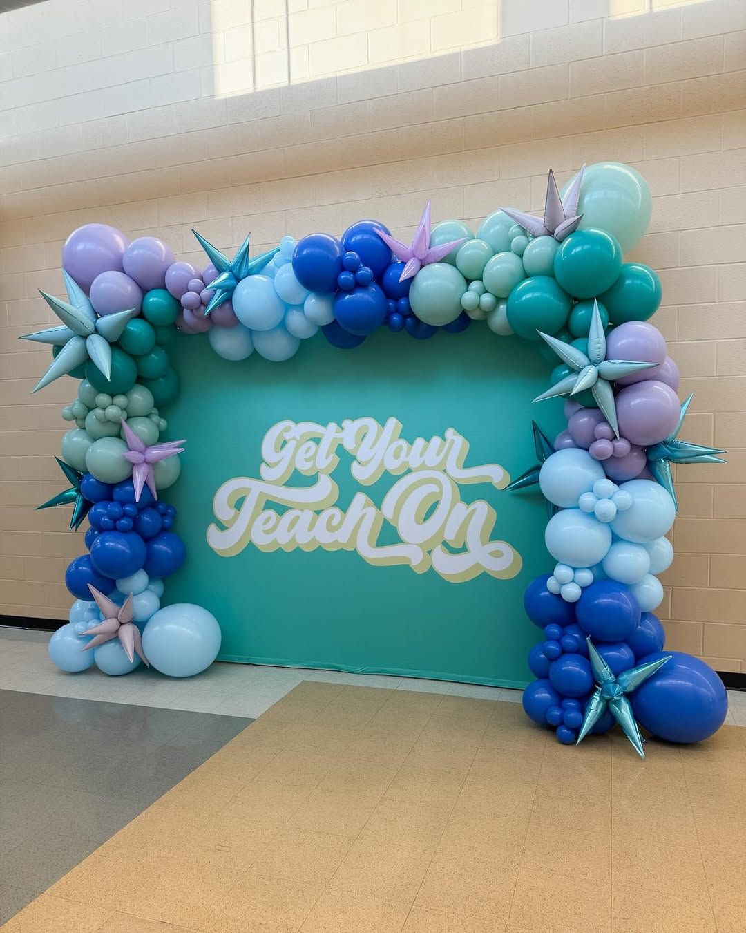 A teal backdrop with the text 