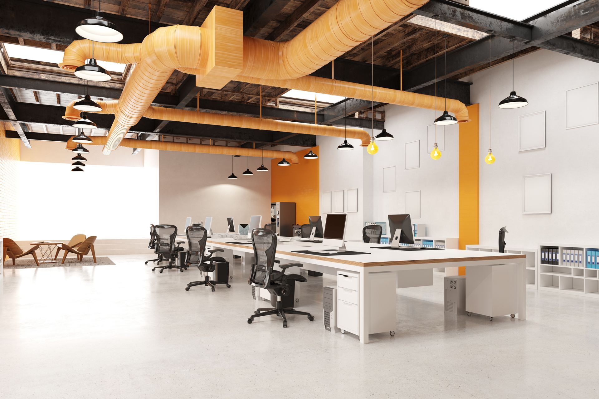 Modern office space with desks, chairs, computers, and hanging lights. Features orange accents and exposed ductwork.