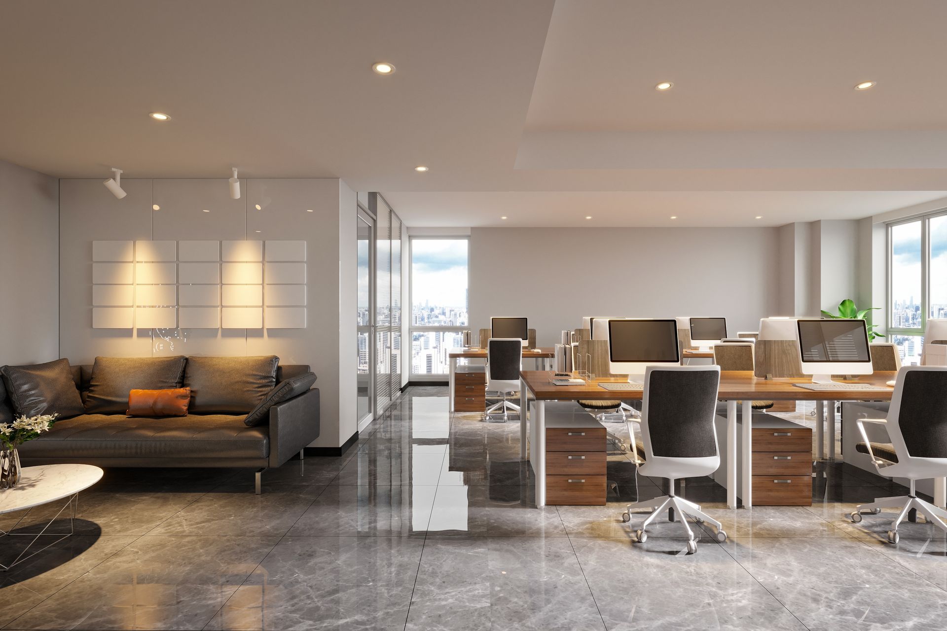 Modern office featuring large windows and a marble floor, creating a bright and elegant workspace.