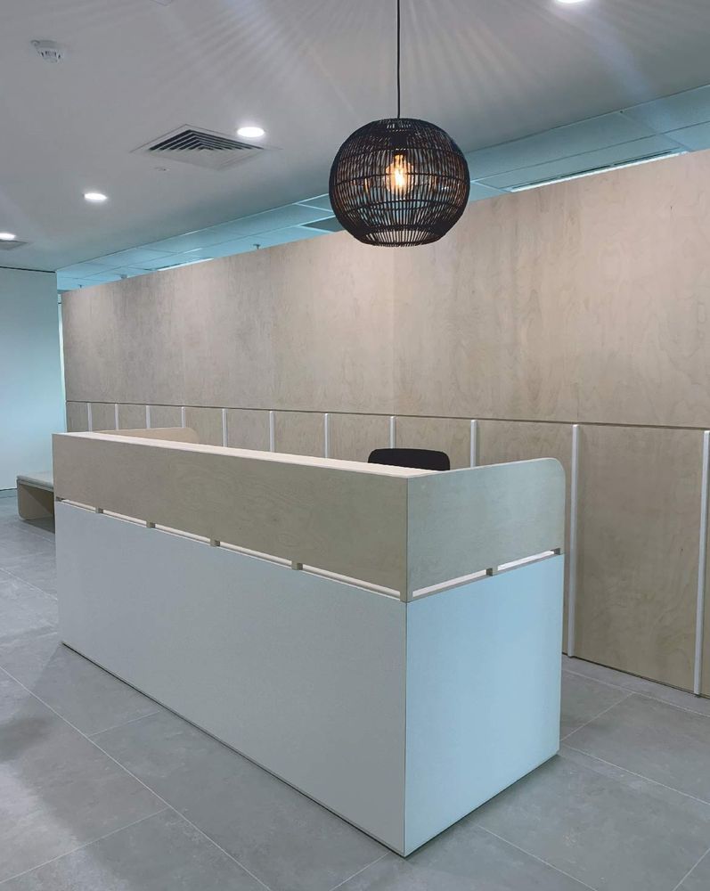 A lobby with a table and chairs and a sign that says healthco advisory