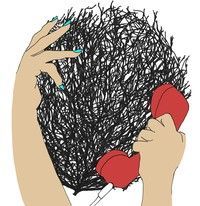 A woman is holding a red telephone in front of her hair.