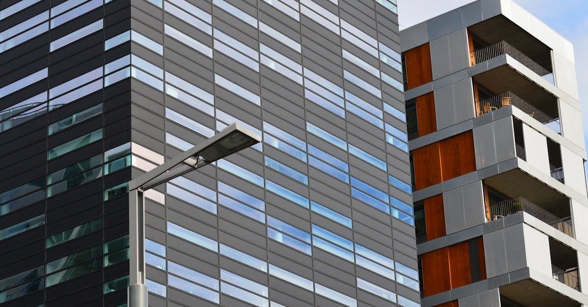 A close up of a building with a street light in front of it.