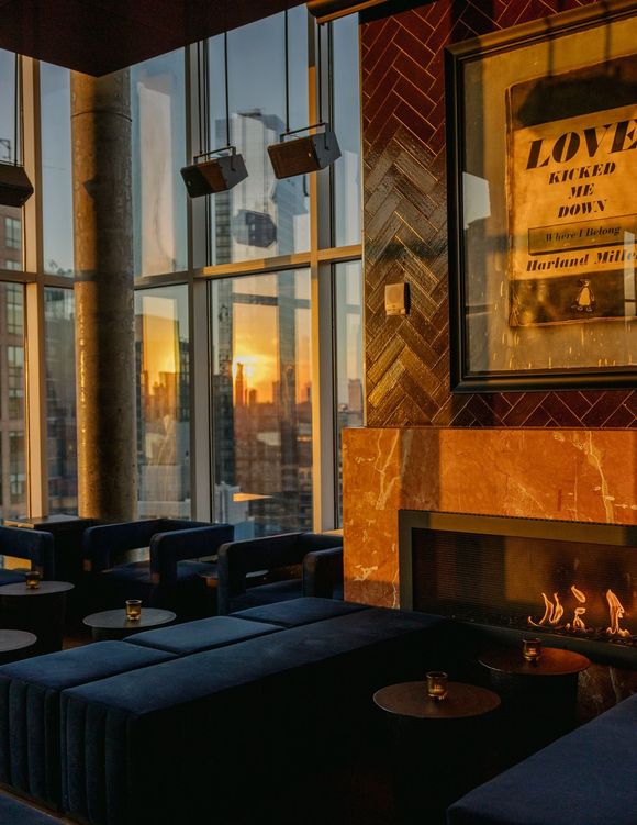 Two women in bikinis are standing next to a swimming pool.