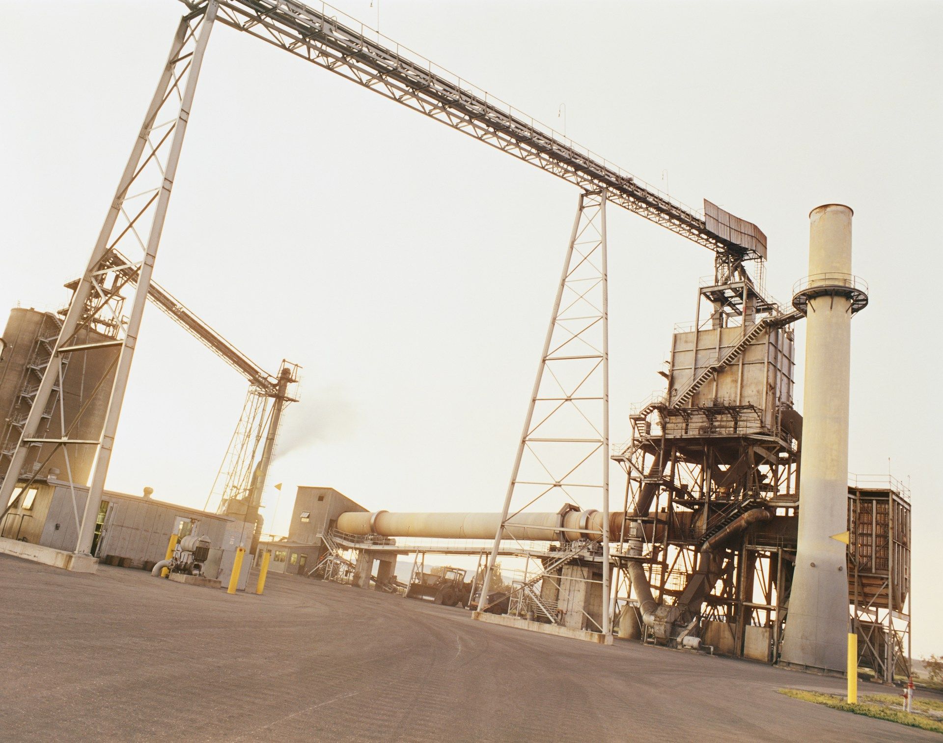 A large factory with a lot of pipes going through it