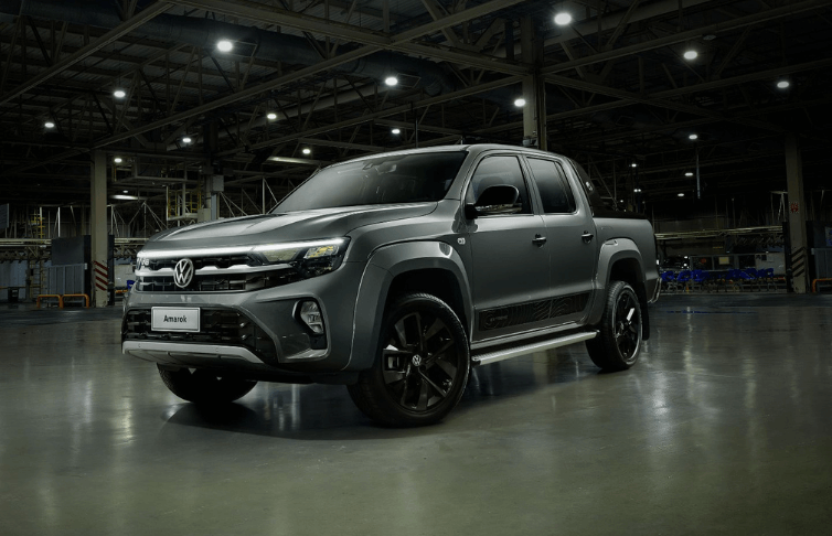 A volkswagen amarok is parked in a warehouse.