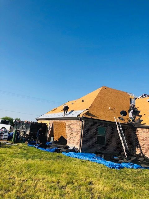 roof replacement with care to catch all the nails on tarps