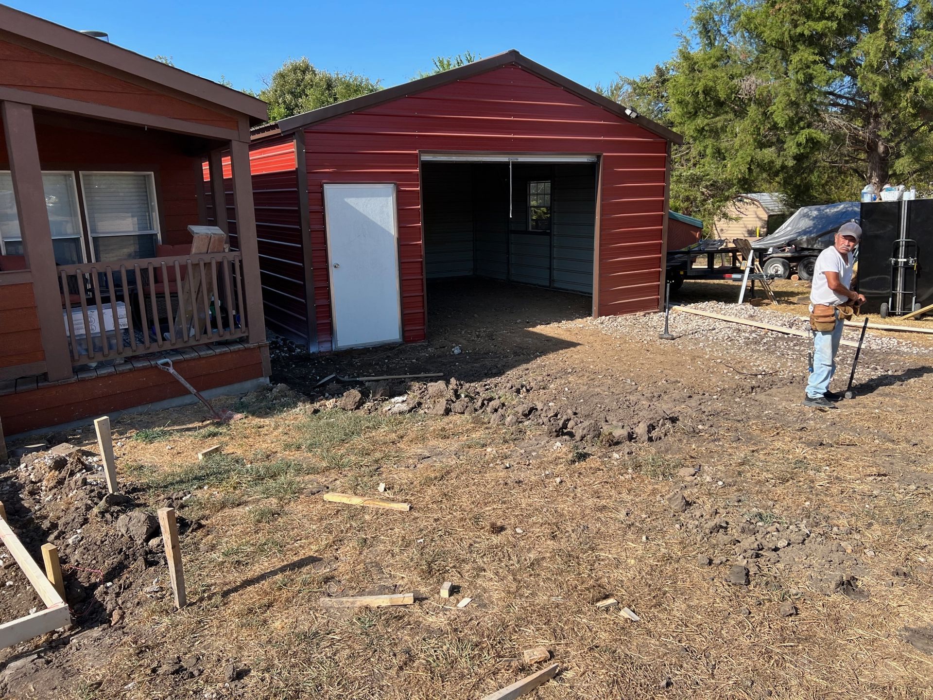 red metal shop building by pro roofing and construction
