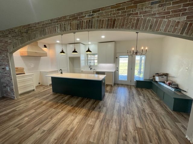 pen concept kitchen and living room by pro roofing and construction