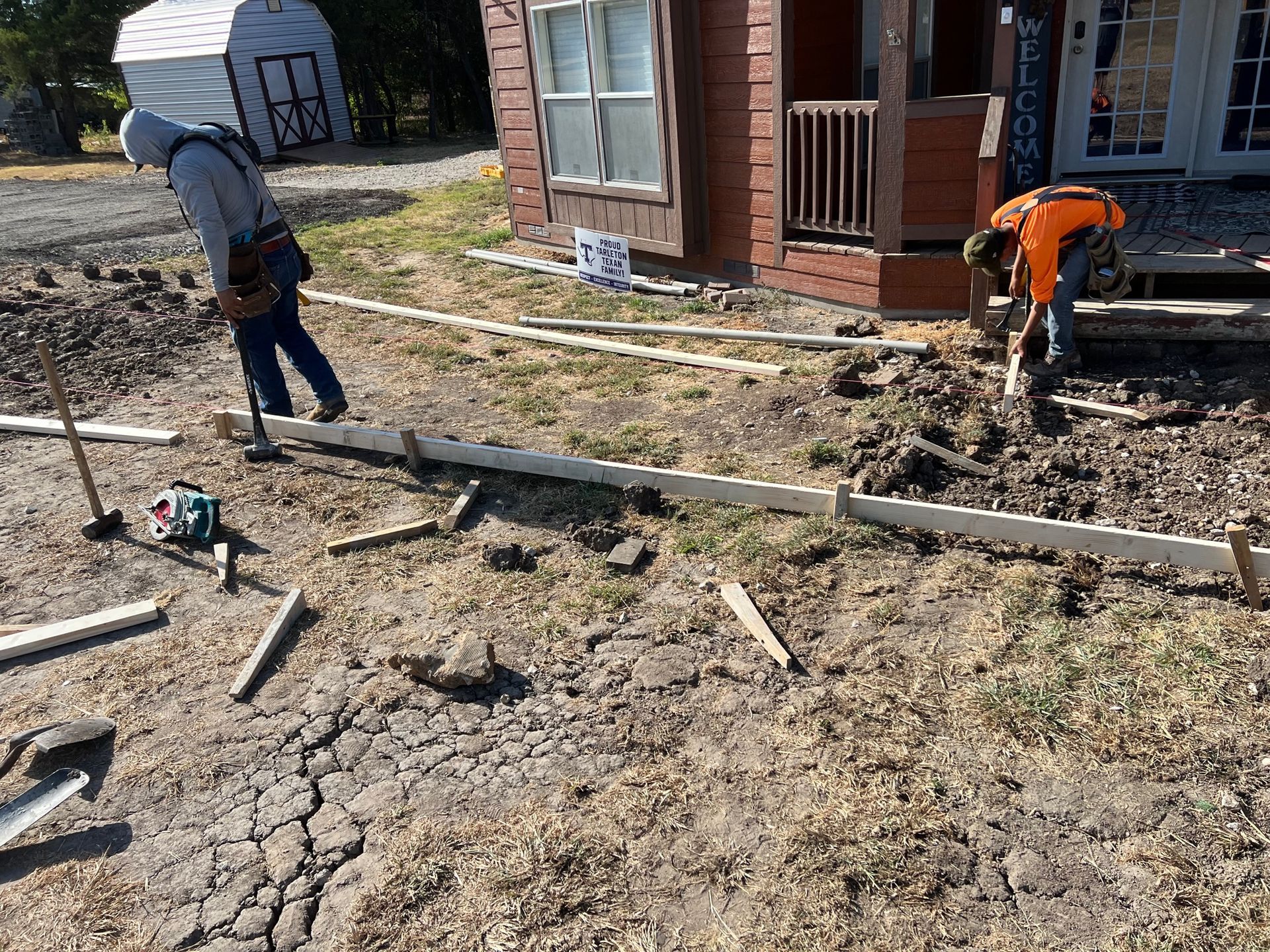 Concrete porch added to existing home built by pro roofing and construction