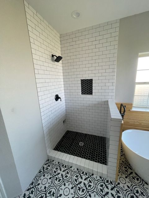 custom shower with glass doors made by pro roofing and construction