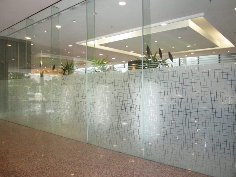 Glass office walls with frosted design.